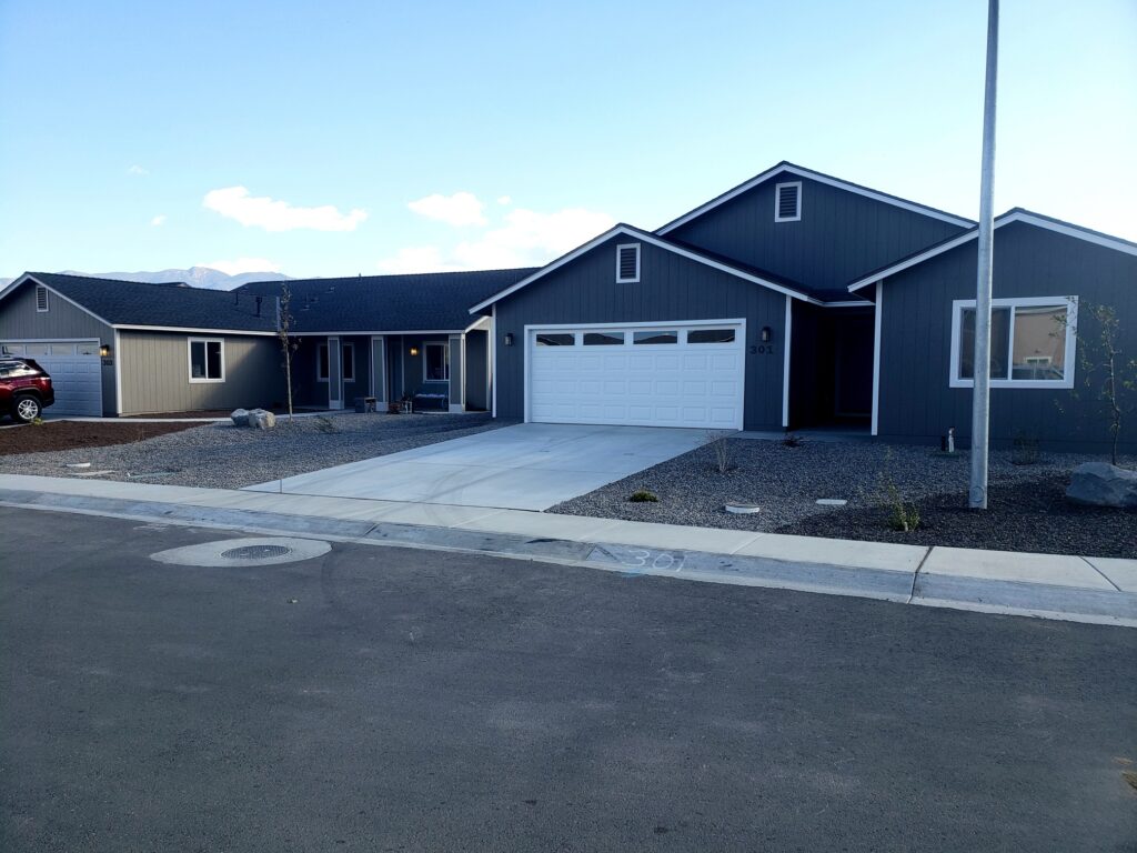 Newly constructed single-family home in Dayton Gold Country Estates Phase 4, featuring a two-car garage and modern design.